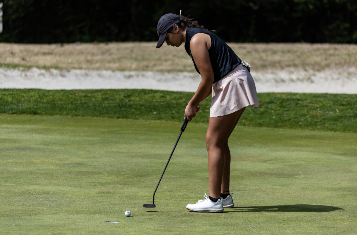 Sophomore Caitlyn Chilito putts the ball. Chilito led the Lady Lions in the final round of the Chick-fil-A Invitational, finishing with an 81.